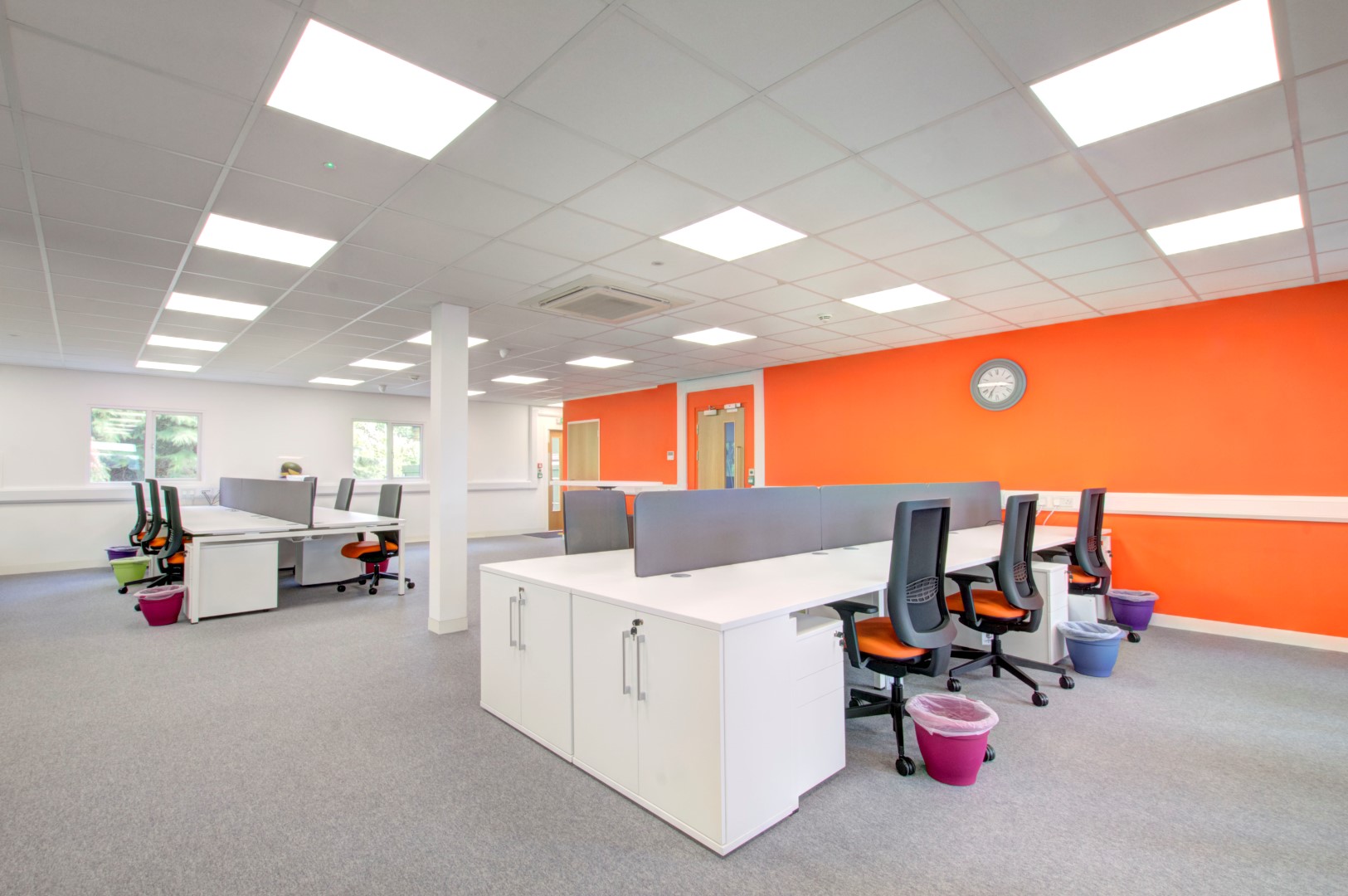 A Modern Office With White And Orange Walls Created By An Office Fit Out Company 
